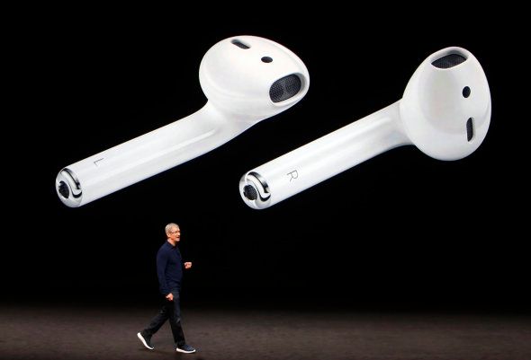 AirPods are displayed as Apple Inc CEO Tim Cook makes his closing remarks