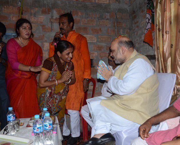 National President of Bharatiya Janata Party (BJP), Amit Shah meets the party wokers during the visit of suburban area of Rajarhat Newtown Constituency in Kolkata.