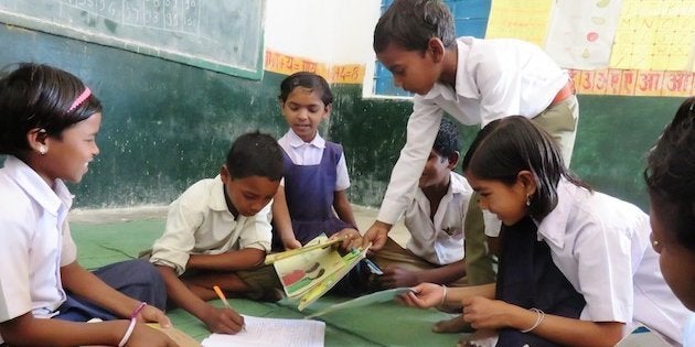 Children issuing books at the Anandghar library in Kajrah village in Balaghat.