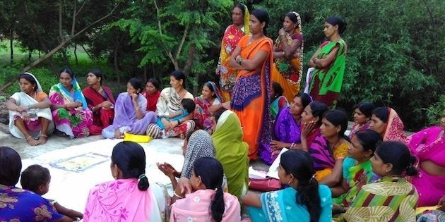 A woman’s meeting in Jehanabad discussing the benefits of building toilets in homes.
