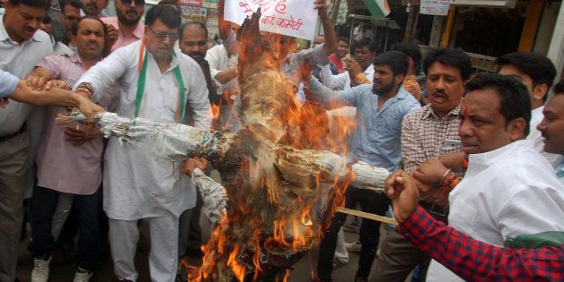Demonstrators burn an effigy of Madhya Pradesh Chief Minister Shivraj Singh Chauhan at a protest organised by the Congress in Bhopal on 7 June 2017.
