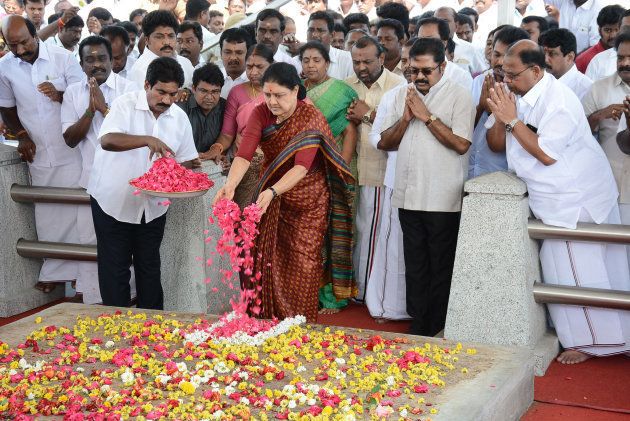 All India Anna Dravida Munnetra Kazhagam (AIADMK) leader VK Sasikala pays her respects at the memorial for former state chief minister Jayalalithaa Jayaram before leaving to surrender to authorities, following a Supreme Court ruling, in Chennai on Febuary 15, 2017.