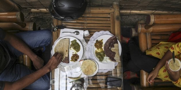 Customers eat plates of food at the Vaathsalya Millet Cafe in Bengaluru, India, on Saturday, June 10, 2017.