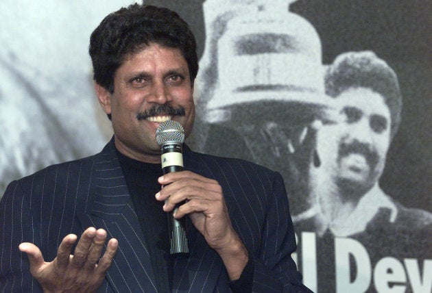 Former Indian cricket coach and captain Kapil Dev gestures during a news conference in New Delhi, November 20, 2001.
