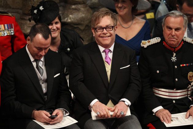 Elton John (C) and partner David Furnish (L) attend the wedding service for Britain's Prince William and Kate Middleton.