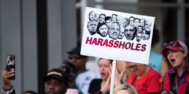 Protesters attend a Me Too rally to denounce sexual harassment and assaults of women in Los Angeles, California on November 12, 2017.