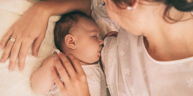 Mother holding her baby.