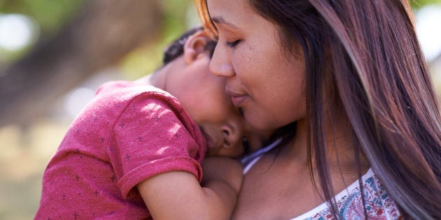 Shot of a little boy being comforted by his mother.