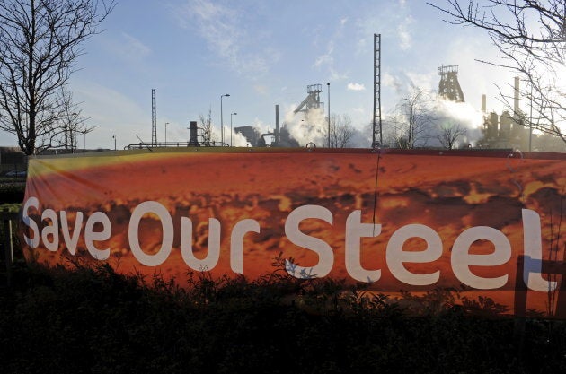 A sign is seen in front of the Tata steelworks in the town of Port Talbot, Wales, Britain March 30, 2016. REUTERS/Rebecca Naden.