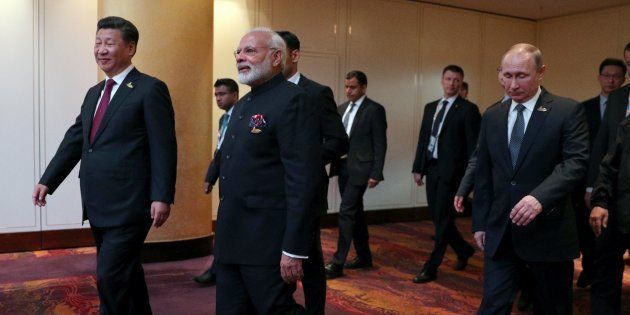 HAMBURG, GERMANY - JULY 07: President of China Xi Jinping (L), Prime Minister of India Narendra Modi (C) and President of Russia Vladimir Putin (R) arrive to attend a meeting of BRICS leaders within the G20 Leaders' Summit in Hamburg, Germany on July 07, 2017.