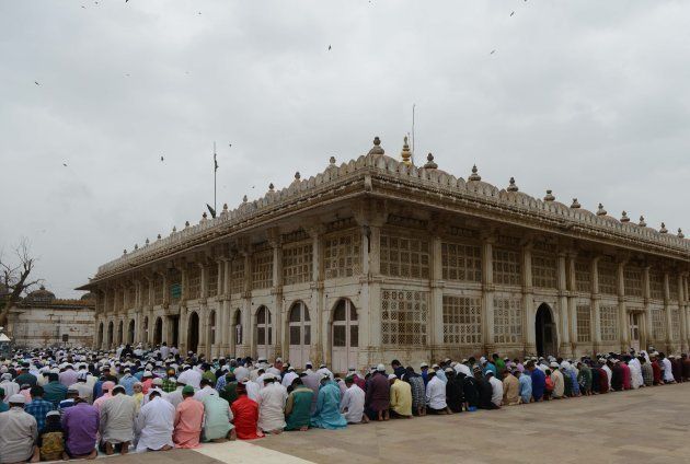 Muslims offer Eid al-Fitr prayers at the ancient Sarkhej Roza and masjid in Ahmedabad on July 7, 2016.