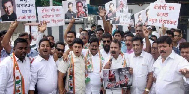 Congress party workers hold placards against Bollywood director Madhur Bhandarkar to protest against his upcoming film “Indu Sarkar” in Nagpur on Sunday.