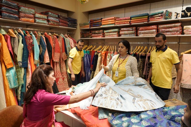 NEW DELHI,INDIA-NOVEMBER 05: People shopping on the day of Dhanteras during the opening of Baba Ramdevs clothing showroom Patanjali Paridhan at Netaji Subhash Place, in New Delhi. (Photo by Hardik Chhabra/India Today Group/Getty Images)