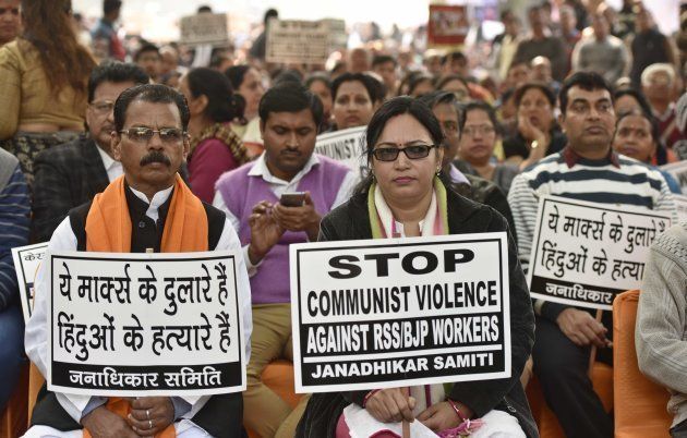 Supporters and workers holding placard during the protest against brutal attack on RSS-BJP workers in Kerala on January 24, 2017 in New Delhi.