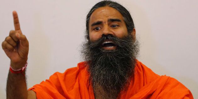 Indian yoga guru Baba Ramdev gestures as addresses the media during a news conference in Ahmedabad, India, May 10, 2017. REUTERS/Amit Dave