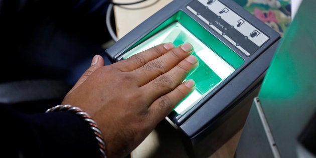 A woman goes through the process of finger scanning for the Aadhaar, at a registration centre in New Delhi.