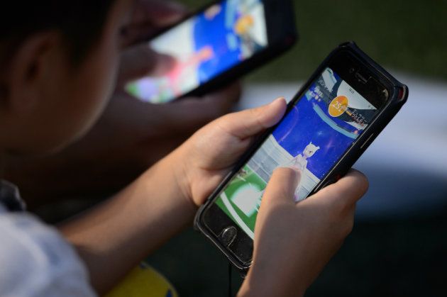 Playing Nintendo's Pokemon Go augmented-reality game.