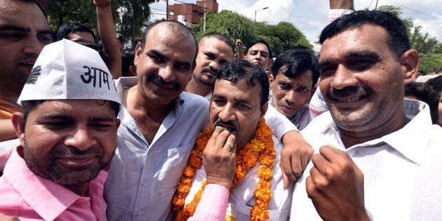 Ram Chandra, AAP candidate (center) along with his supporters after winning Bawana assembly by-poll, election at Ali Pur on August 28, 2017 in New Delhi, India.