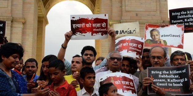 Indian activists take part in a protest rally against the killing of Indian journalist Gauri Lankesh at the India Gate memorial in New Delhi on September 6, 2017.