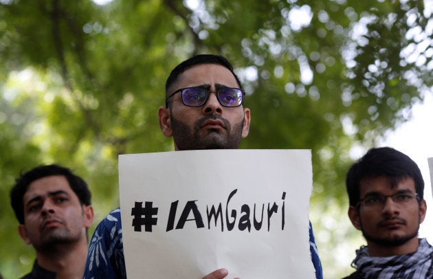 A protester holds a placard during a protest rally against the killing of Gauri Lankesh, an Indian journalist, in New Delhi.