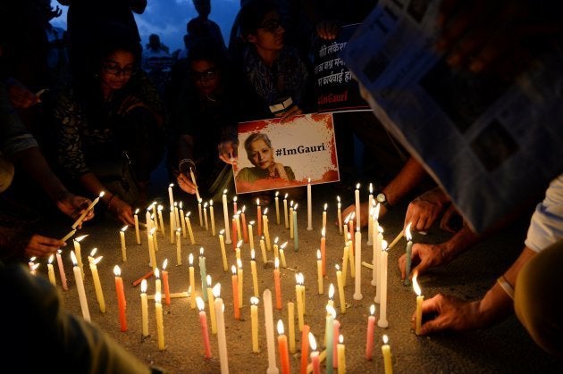 Indian activists take part in a protest rally against the killing of Indian journalist Gauri Lankesh at the India Gate memorial in New Delhi on September 6, 2017.