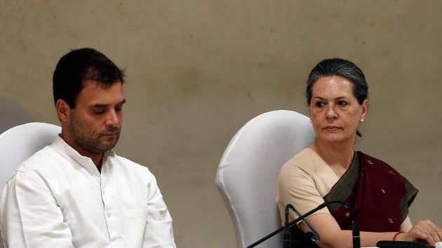 Congress party chief Sonia Gandhi (R) and her son and vice-president of Congress Rahul Gandhi attend the Congress Working Committee (CWC) meeting in New Delhi May 19, 2014.