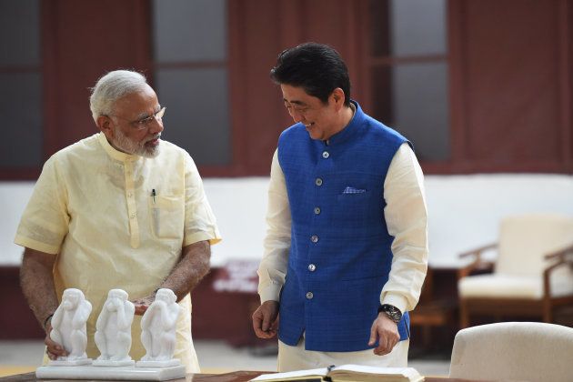 Japanese Prime Minister Shinzo Abe (C) and Indian Prime Minister Narendra Modi visit Sabarmati Ashram, in Ahmedabad on September 13, 2017.