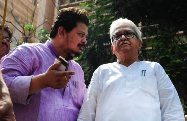 Ritabrata Banerjee, Member of Parliament (Rajya Sabha) with Biman Basu CPIM leader during a rally called by four left student organisations - SFI, AISF, AISB, PSU started from College square ended with a law violation movement at Dharmata, on April 2, 2015 in Kolkata.
