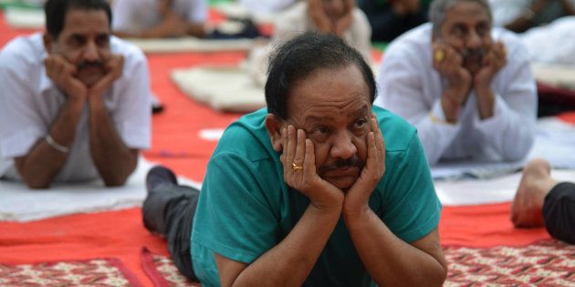 Harsh Vardhan, Indian Union Minister for Environment, Science and Technology, takes part in a yoga session on International Yoga Day in Amritsar.