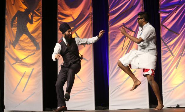 NDP MPP Jagmeet Singh dances on stage with Banugan Kanagaratnam at a dance competition in Toronto on March 22, 2014