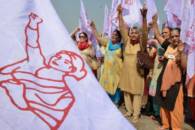 Members of All India Democratic Women's Association (AIDWA) shout slogans during a march for women rights in society and politics, in Amritsar on October 13, 2017.