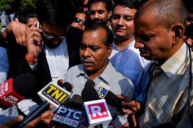 The father of Indian gangrape victim 'Nirbhaya' addresses media representatives as he leaves The Supreme Court in New Delhi on May 5, 2017.