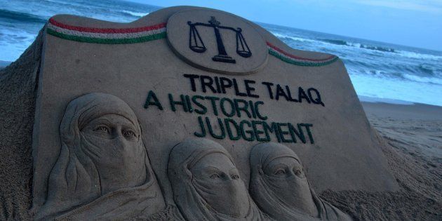 A sand art is seen at the Bay of Bengal, Sea's eastern coast beach as it created by Indian sand artist Sudarshan Patnaik for public awareness about the Supreme Court Judgement about the muslim community. On 23 August 2107 in Puri.