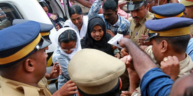 Akhila, 24, who converted to Islam in 2016 and took a new name, Hadiya, arrives at the airport in Kochi, India November 25, 2017. REUTERS/Sivaram V