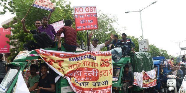 People connected with the textile industry participate in a protest rally against the recently introduced Goods and Service Tax (GST) in Ahmedabad on July 15, 2017.