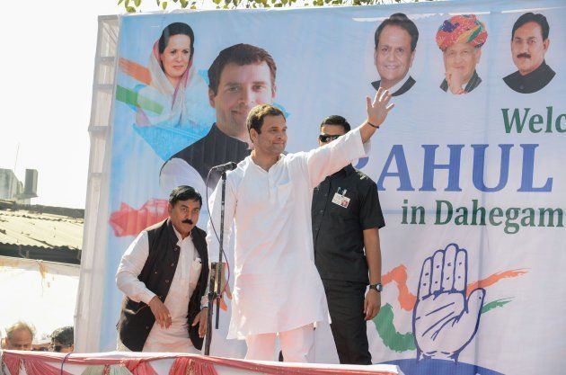 Congress Vice President Rahul Gandhi (C) waves as he arrives to address a rally in Dahegam, some 40km from Ahmedabad, on November 25, 2017.