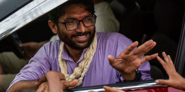 An independent candidate Jignesh Mevani greets people during election campaign on December 10, 2017 in Vadgam, India.