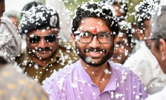 Jignesh Mevani greets people during his election campaign on December 10, 2017 in Vadgam.
