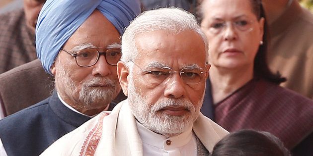 Prime Minister Narendra Modi (C), former Prime Minister Manmohan Singh (L) and Sonia Gandhi, leader of India's main opposition Congress Party, wait to pay homage to the victims of the December 2001 parliament attack on its anniversary in New Delhi, India, December 13, 2017. REUTERS/Adnan Abidi