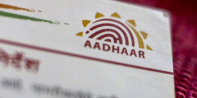 An Aadhaar biometric identity card, issued by the Unique Identification Authority of India (UIDAI), is arranged for a photograph in Mumbai, India, on Saturday, Jan. 28, 2017.