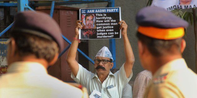 Aam Aadmi Party workers demand inquiry into the death of Justice Loya at Azad Maidan on November 30, 2017 in Mumbai.