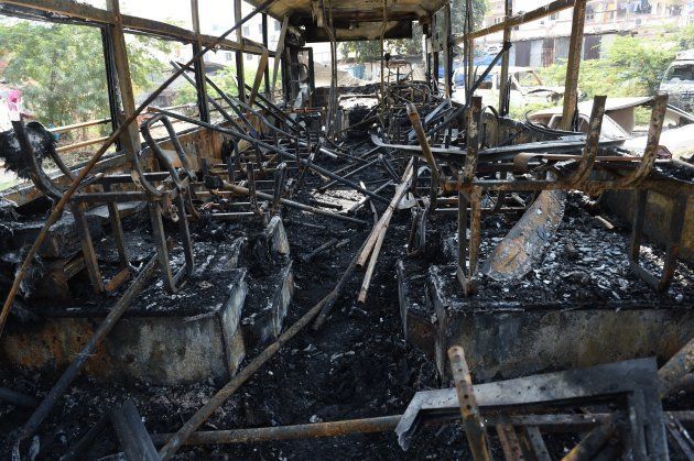 The charred interior of a bus are seen at Sanand town, some 30 kms. from Ahmedabad on January 21, 2018.