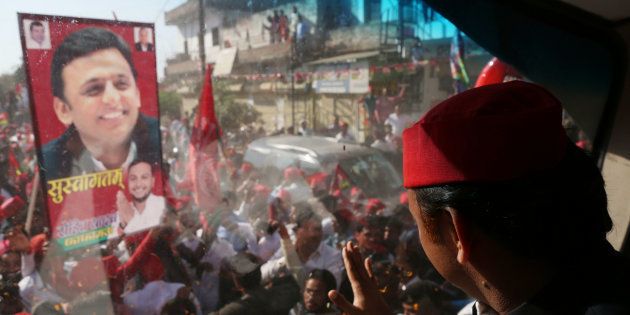 Samajwadi Party's national president and former Chief Minister of state of Uttar Pradesh Akhilesh Yadav waves towards party supporters during his road show for the by poll of PhulPur Lok Sabha seat , in Allahabad on March 9, 2018.