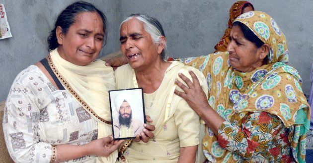 Joginder Kaur grieving the death of her son Gurcharan Singh on March 20, 2018 near Amritsar, India.