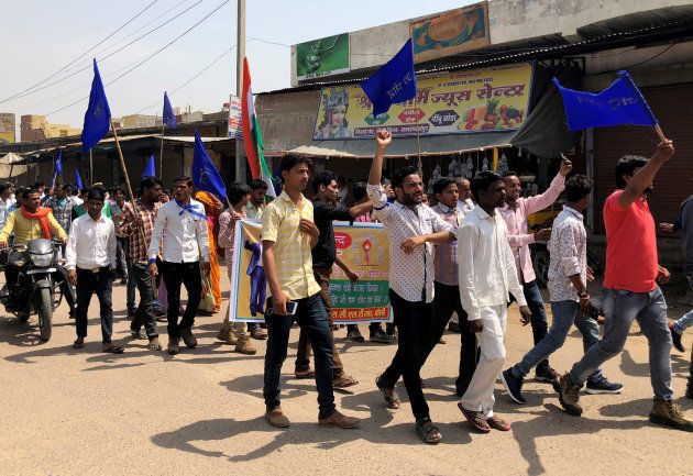 People belonging to the Dalit community shout slogans as they take part in a nationwide strike called by several Dalit organisations, in Kasba Bonli, in Rajasthan.