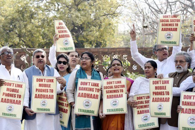 TMC MPs hold placards against implementation of Aadhaar card during Budget Session at Parliament House on March 13, 2018 in New Delhi, India. (Photo by Arvind Yadav/Hindustan Times via Getty Images)