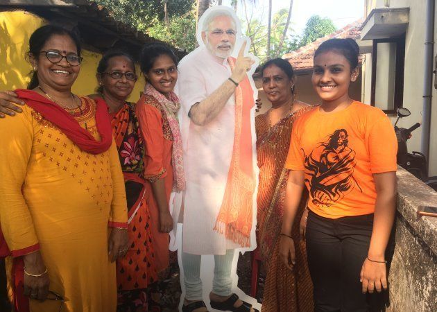 Bhavna Keremata poses with her friends and family next to a cutout of Prime Minister Narendra Modi in Udupi on May 1, 2018.