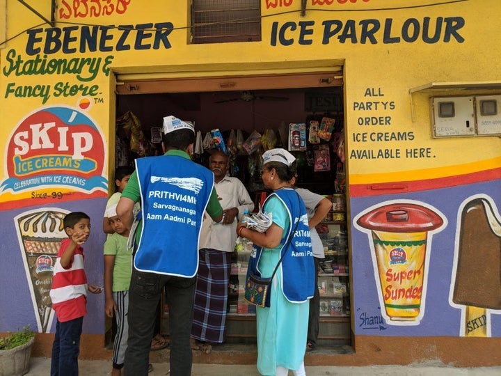 AAP volunteers distribute pamphlets in Bengaluru.