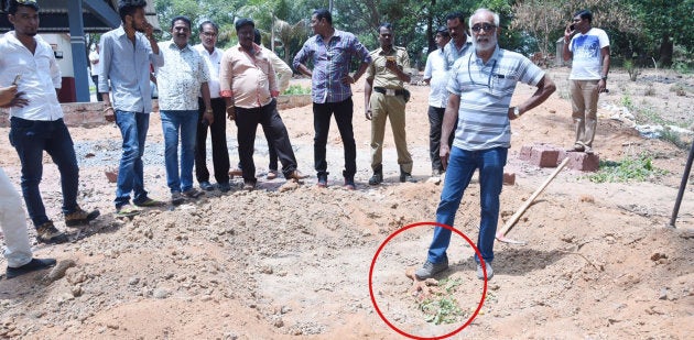 Rationalist Narendra Nayak stomps on a voodoo doll at the Nandigudda Graveyard in Mangalore, Karnataka in May, 2018.