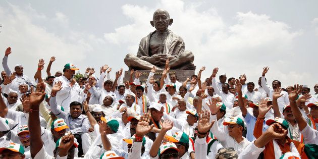 Lawmakers from the Congress party and the Janata Dal (Secular) protest against the Bharatiya Janata Party leader B.S. Yeddyurappa's swearing-in as Chief Minister of Karnataka, in Bengaluru, May 17, 2018.